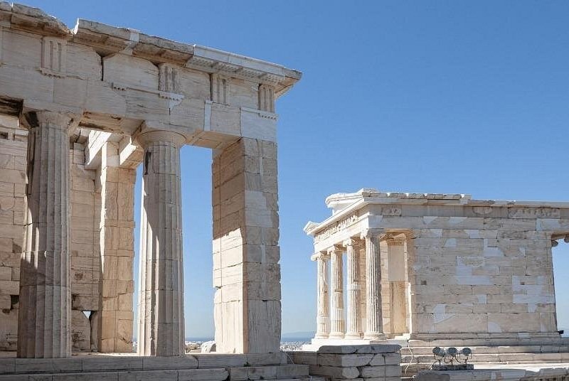 The columns of the Propylaea with the small Temple of Athena Nike on its bastion beyond