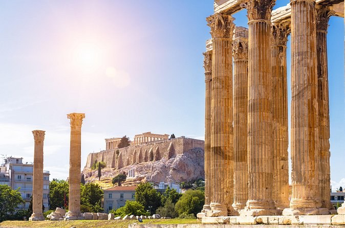 The columns of the Temple of Olympian Zeus with the Acropolis on the skyline behind
